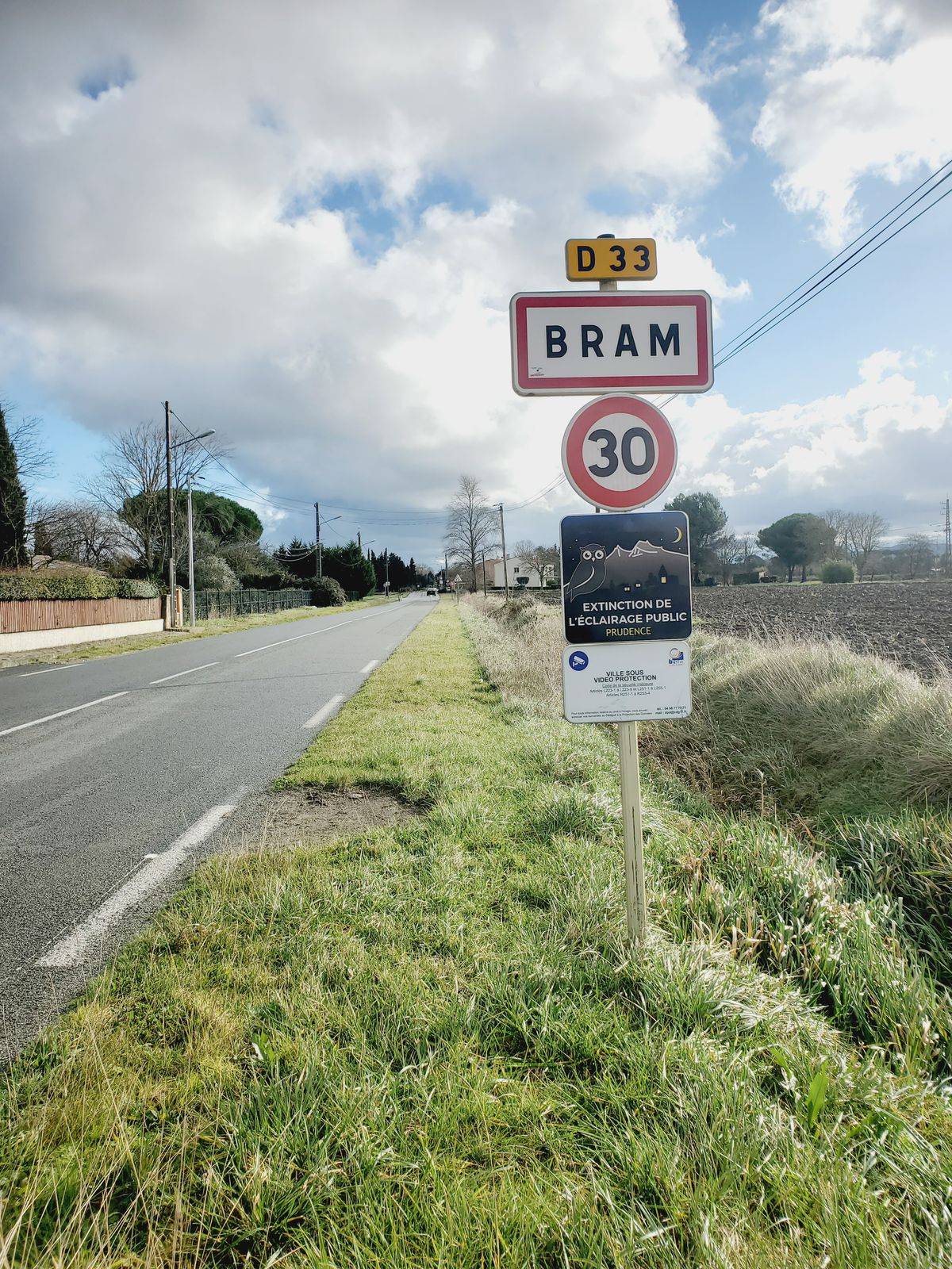 Bram town entry signpost by a road