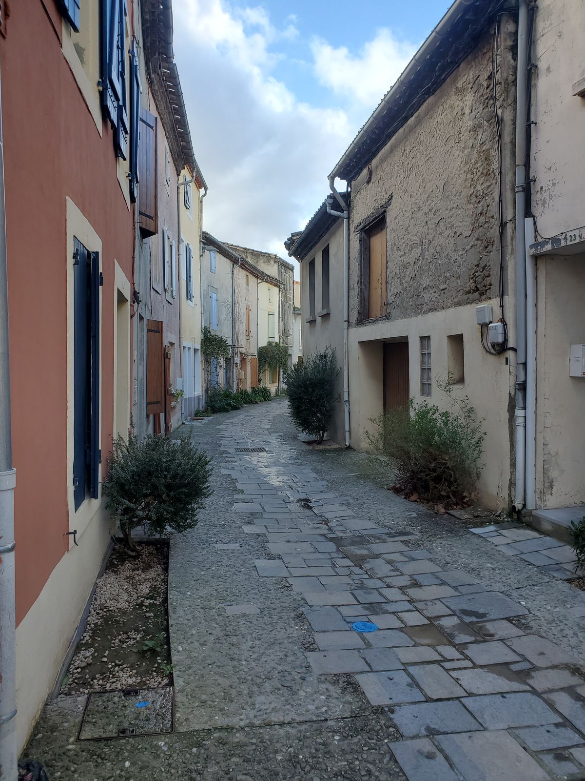 Tiny street in Bram, with houses on both sides