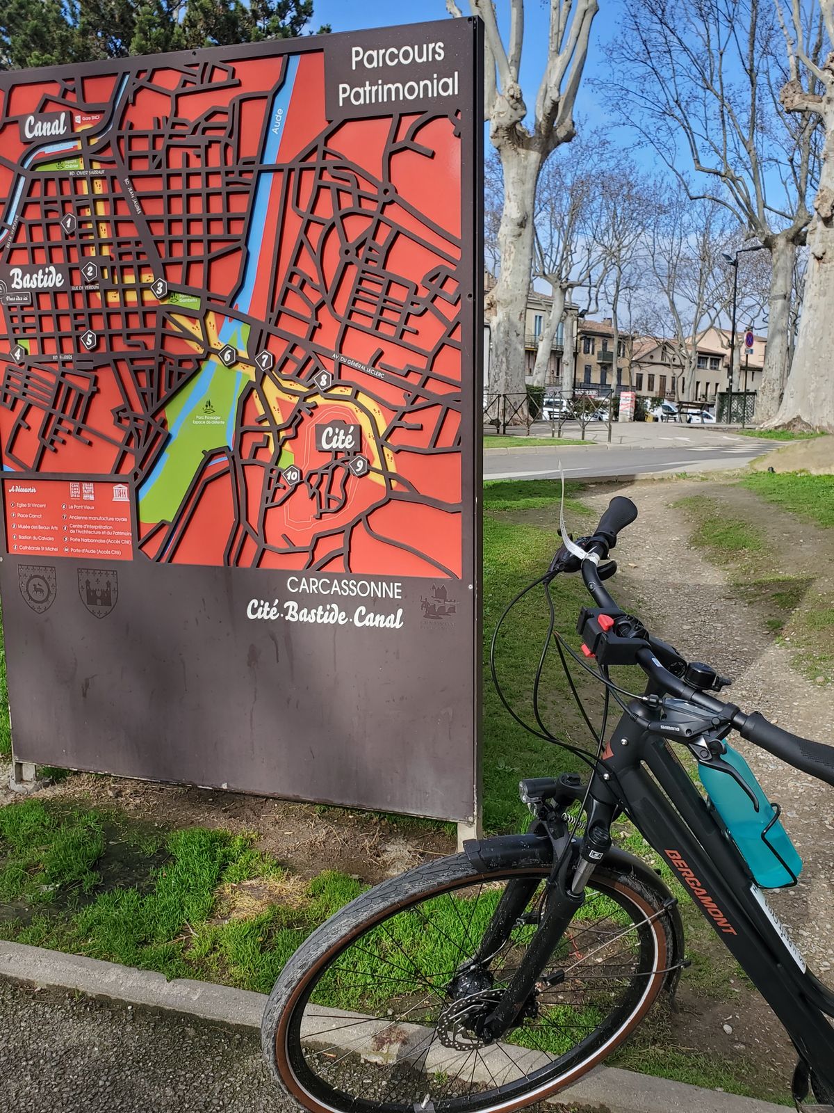 Carcassone city map board, next to rental bike